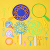 A collection of colorful bubble wands and toys in various shapes and colors laid out on a yellow background.