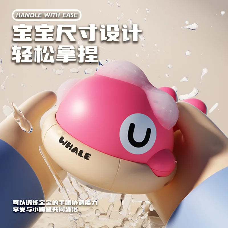 A pink musical light-up whale baby bath toy is shown being held, with water spray visible around it.