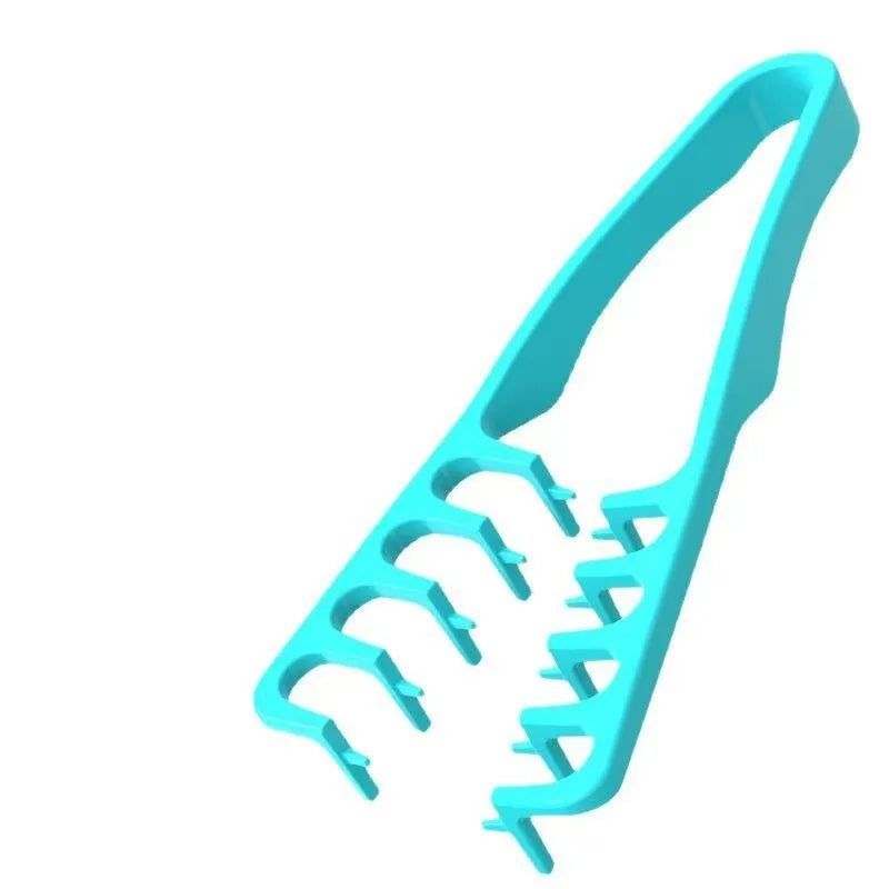 A turquoise volumizing wide-tooth styling comb with a seam covering design.
