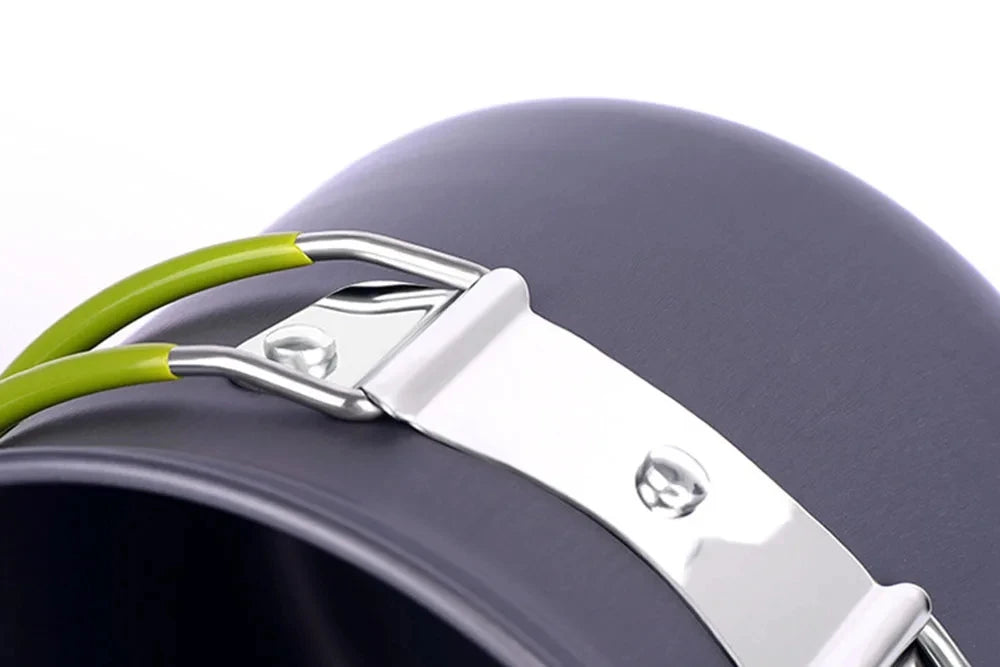 Silver strap and green handle of an ultralight camping cookware mess kit against a dark gray background.