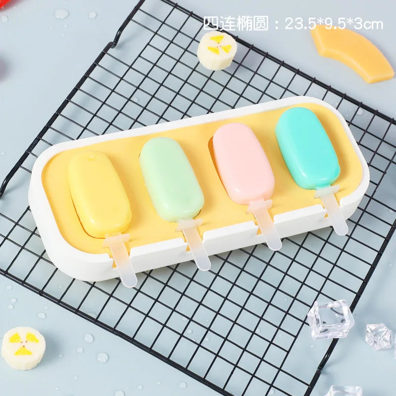 A white silicone mold tray holds five brightly colored popsicle shapes for kids.