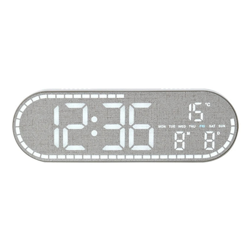 A rectangular digital wall clock displaying the time 12:36, temperature 15 degrees Celsius, and the day of the week.