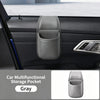 A gray car door storage organizer with a cup holder and phone pocket is shown inside a vehicle interior.