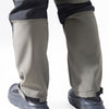 Close-up view of men's waterproof insulated fleece pants in gray and navy fabric.
