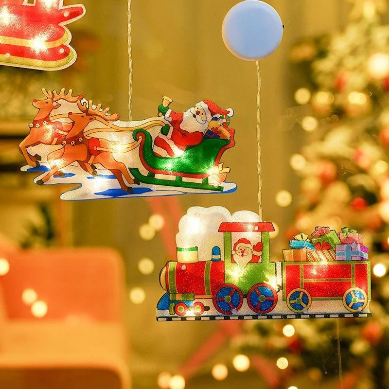 A festive LED Santa Claus window decoration light featuring horses and a train, suspended in a warm, bokeh-lit background.