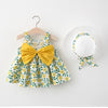 A yellow floral dress and matching sunhat set for a baby girl displayed on a hanger.