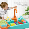 A child plays with a colorful pretend kitchen sink set that simulates running water.