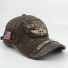 A dark brown vintage washed baseball cap featuring an embroidered skull and the text OLD FUCKER CLUB.