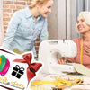A smiling woman is using a white needle threader set for sewing and embroidery on fabric.