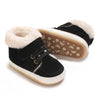 A pair of black baby winter snow boots with white soles and fluffy cream-colored faux fur trim.