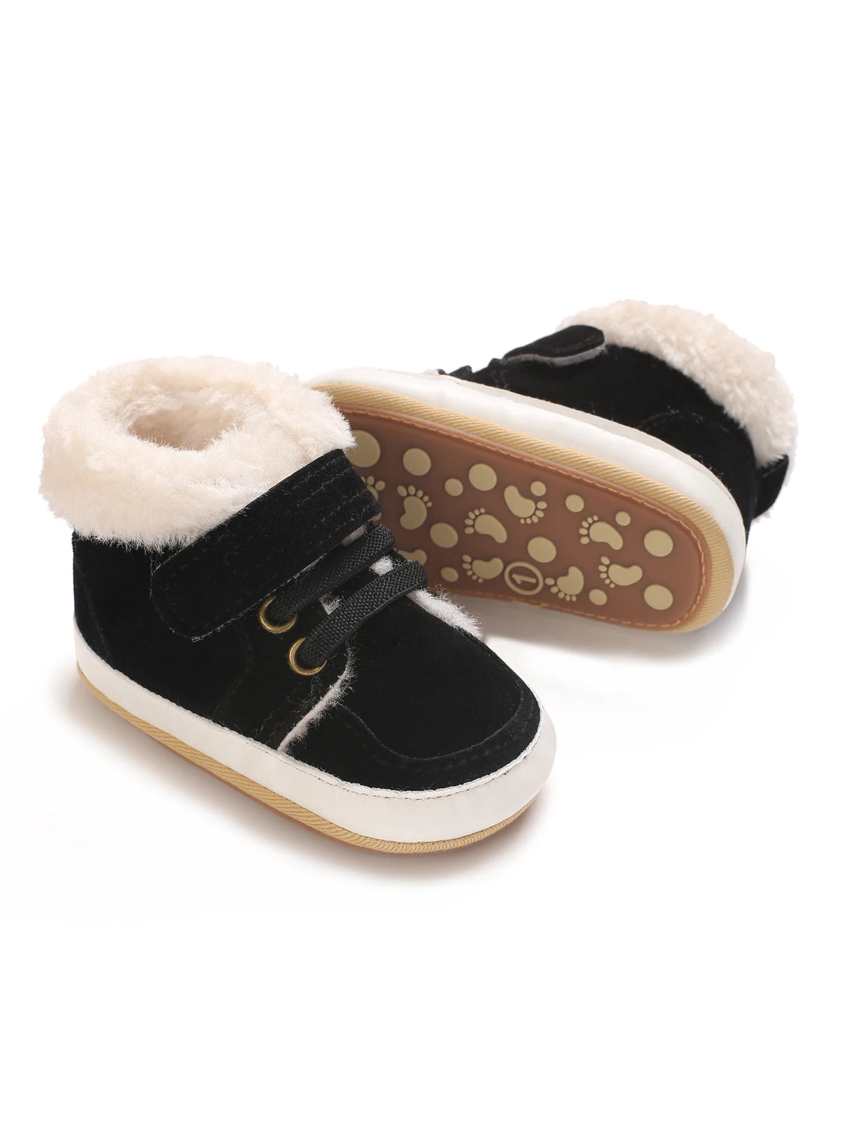 A pair of black baby winter snow boots with white soles and fluffy cream-colored faux fur trim.