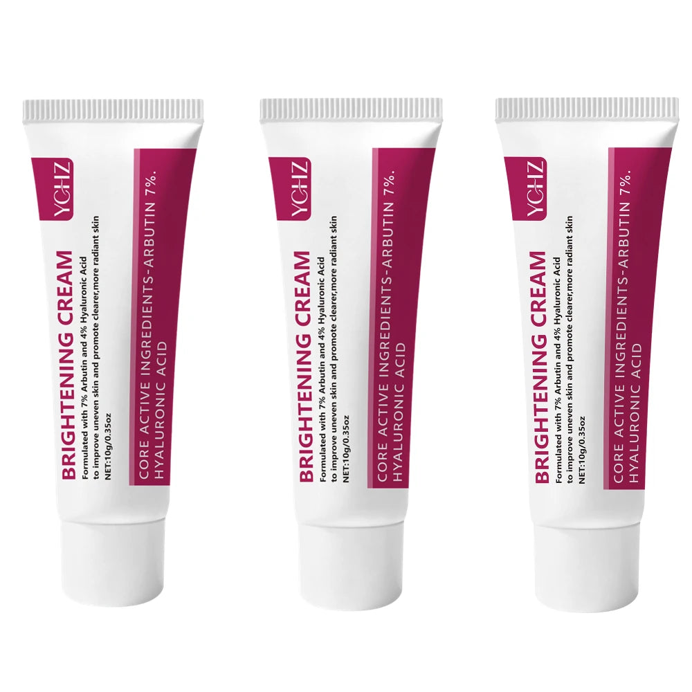 Three tubes of YGHZ brightening cream for skin formulated with Arbutin, Hyaluronic Acid, and Niacinamide.