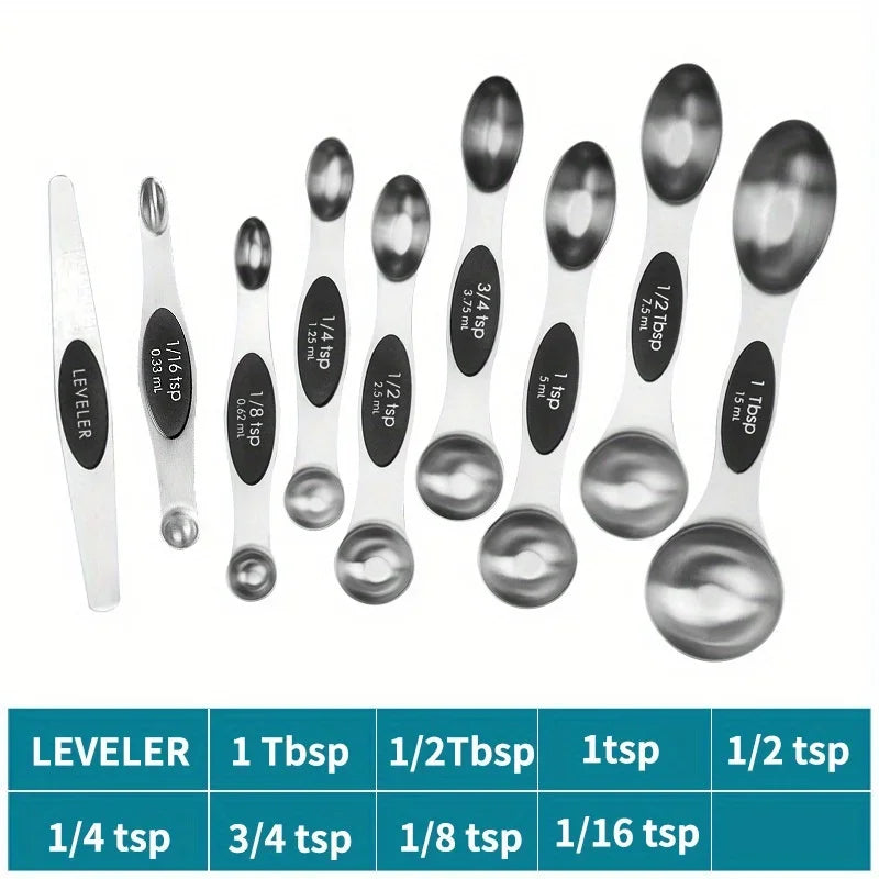 A set of nine stainless steel double-headed measuring spoons with various tablespoon and teaspoon sizes displayed on a white 