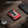A red slim wallet with a black money clip is shown next to a smartphone and a leather watch on a wooden surface.