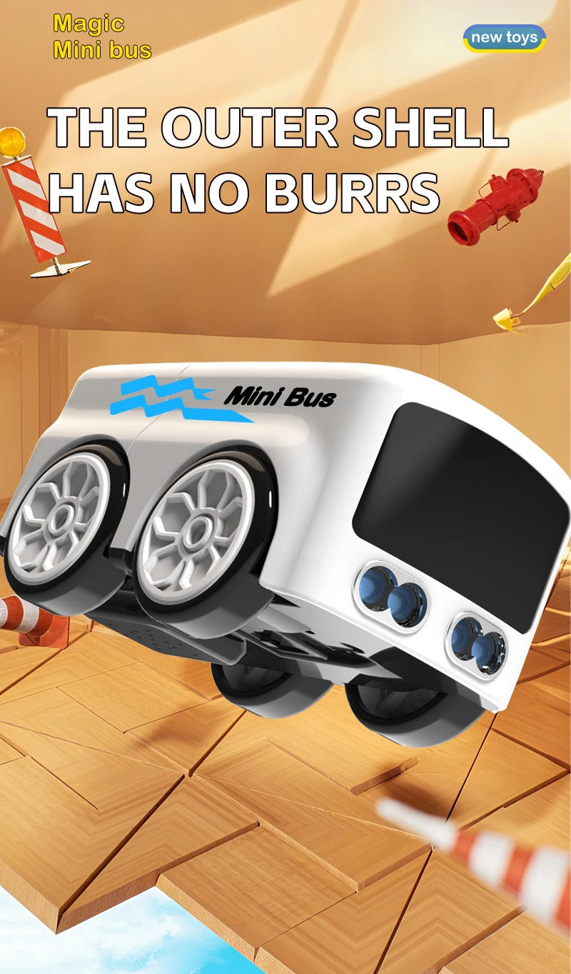 A white Mini Bus toy with large wheels and a black screen is shown in a wooden floor setting.