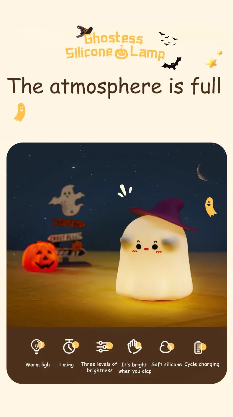 A glowing white silicone pumpkin night light with a purple hat sits on a surface, surrounded by atmospheric elements.