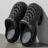 A pair of black men's EVA slip-on sandals with a cushioned platform sole.
