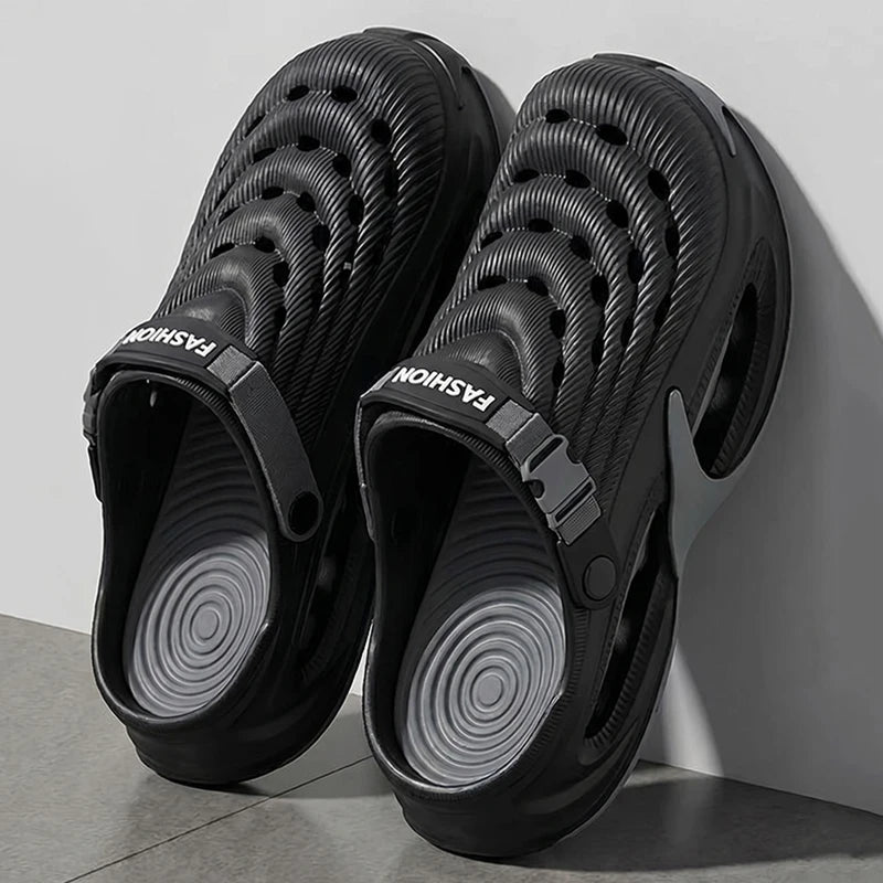 A pair of black men's EVA slip-on sandals with a cushioned platform sole.