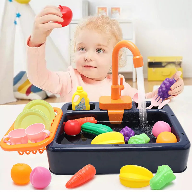 A child is playing with a kids pretend play kitchen sink set featuring various colored fruits and running water.