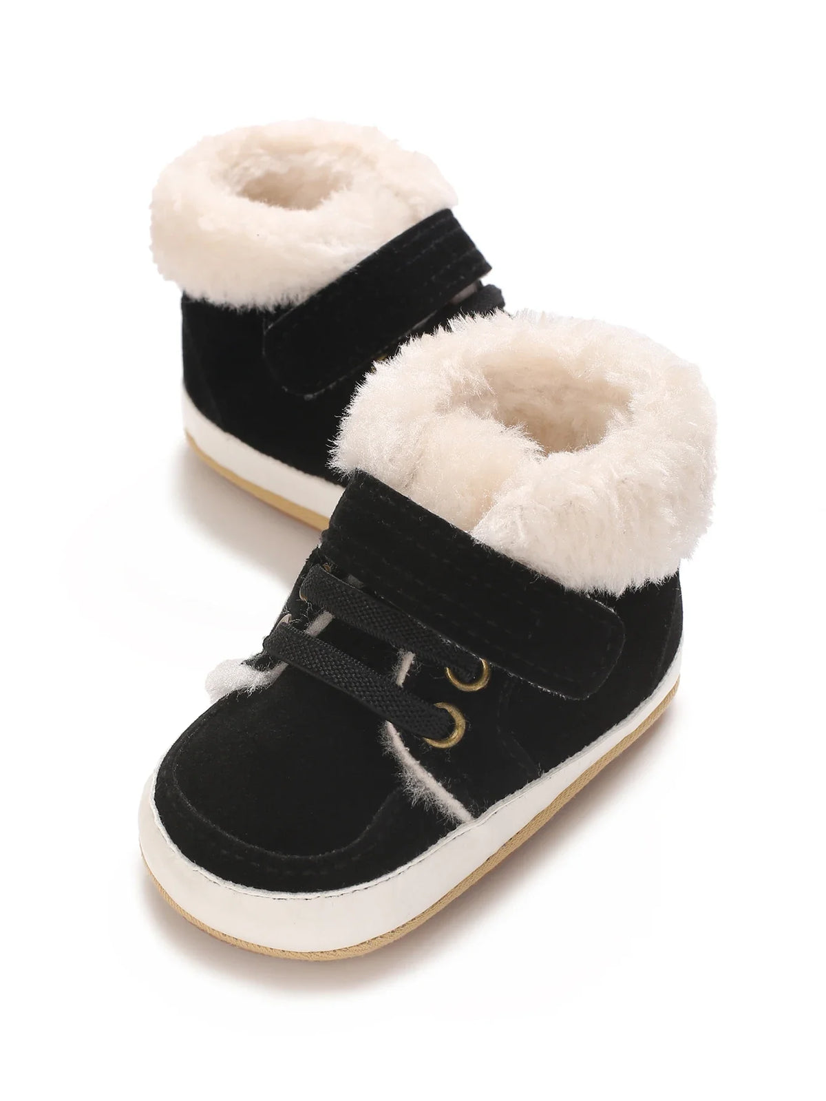 A pair of black baby winter snow boots with light beige faux fur trim and white soles.