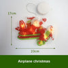 An orange and red airplane Christmas decoration light with a Santa face, measuring 17cm by 23cm.