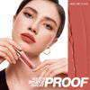 Close-up of a woman applying O.TWO.O lip tint on her face, showcasing the product and its water smudge proof quality.
