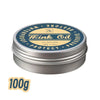 A silver tin of Mink Oil leather conditioner balm with a yellow label and black text.