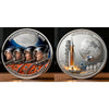 A commemorative space coin featuring astronauts and the moon, titled The Path Back to the Moon.