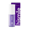 En flaske Hismile corrector serum i lilla emballasje med hvit kork.