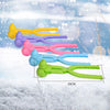 A collection of colorful duck-shaped rice molds in various colors arranged horizontally on a snowy surface.