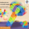 A colorful, segmented magic ruler or snake cube toy is displayed against a light background.