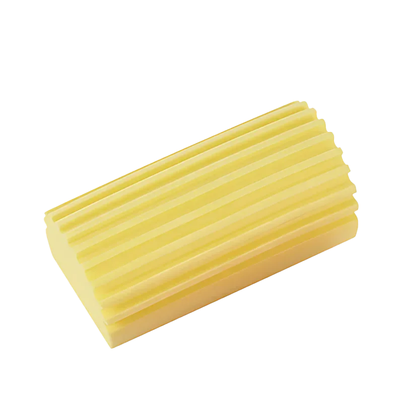 Esponja limpiadora de PVA amarilla y rectangular con estrías paralelas.