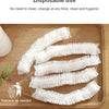 White disposable shower caps with elastic are laid out on a wooden tray for replacement.