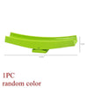 A single lime green marble run building block piece with tracks and funnels.