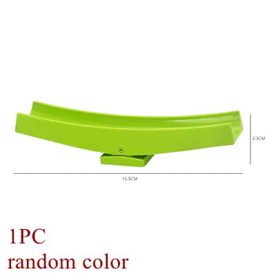 A single lime green marble run building block piece with tracks and funnels.