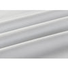 A close-up of a white long-sleeve formal shirt fabric draped and folded.