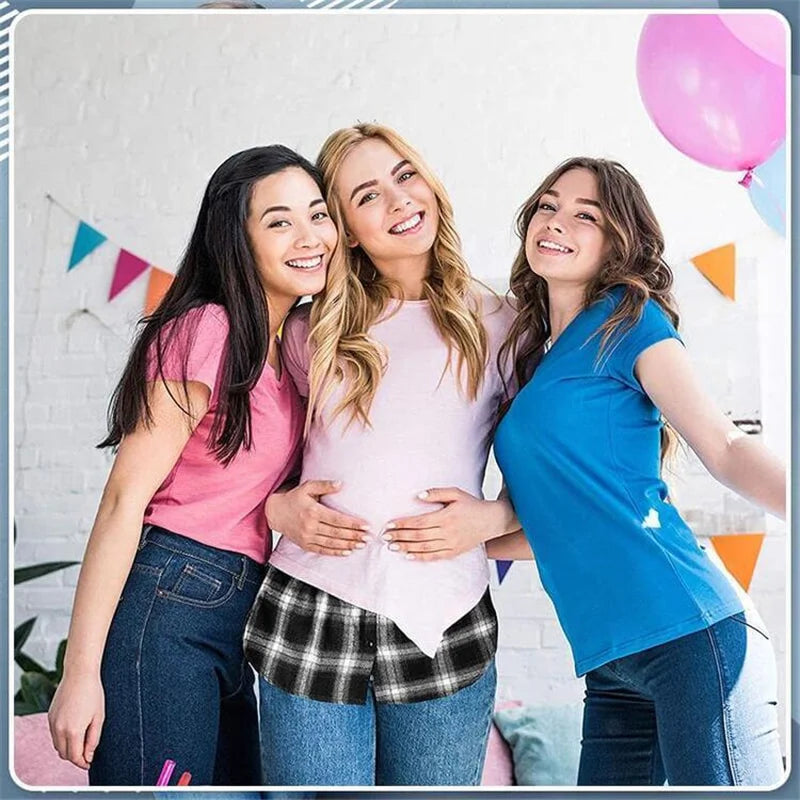 Three young women smiling while posing together indoors