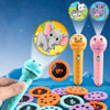 A hand holds a yellow projector flashlight next to various colorful story cards and plastic discs.