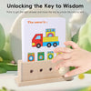 A wooden logic puzzle game featuring a card with a toy truck and multiple boxes, being unlocked by a wooden key.