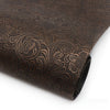 Roll of dark brown vintage floral textured faux leather fabric for crafting projects