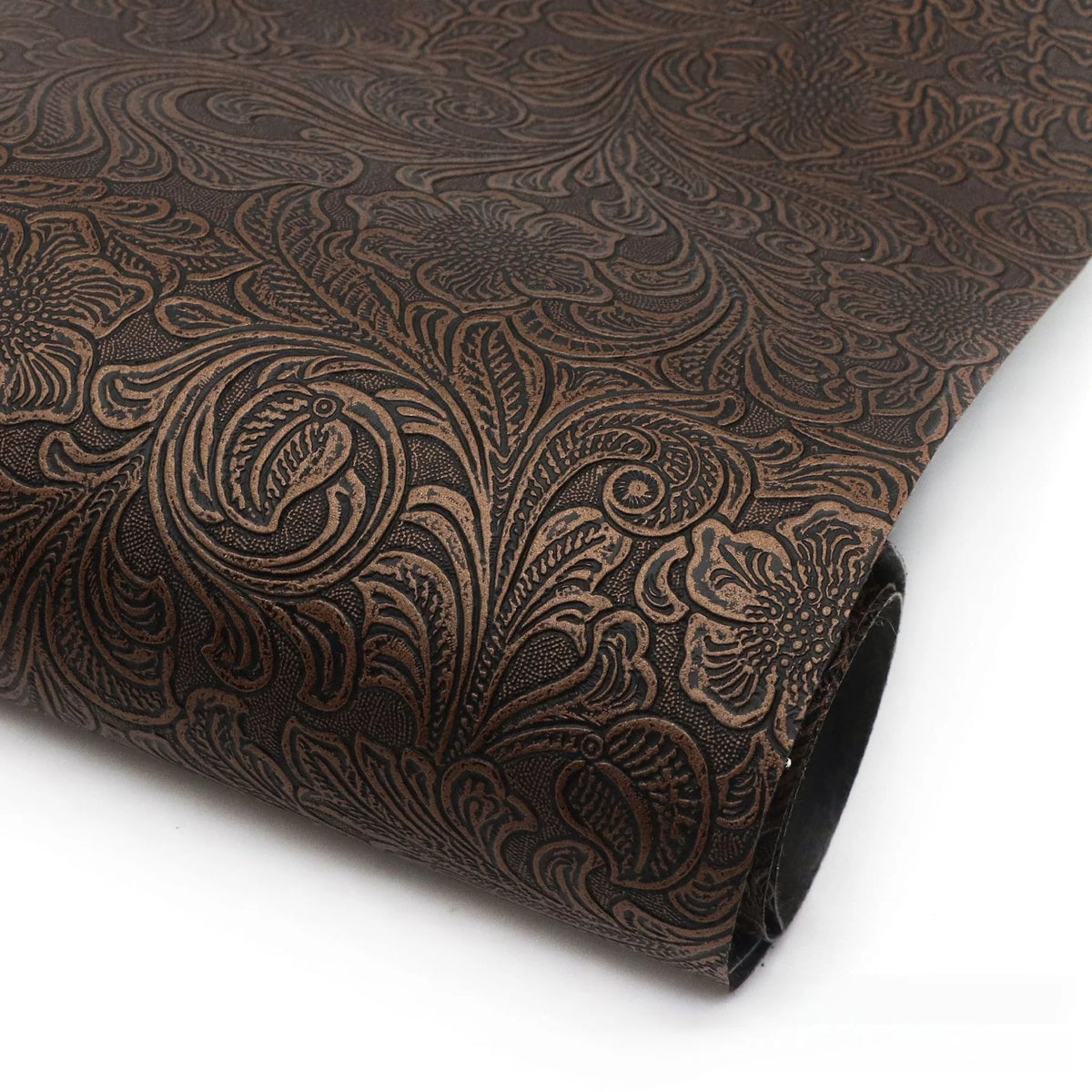 Roll of dark brown vintage floral textured faux leather fabric for crafting projects