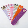 A collection of colorful kids cotton knee-high socks featuring various cartoon animal designs like a bear, a cat, and a fox.