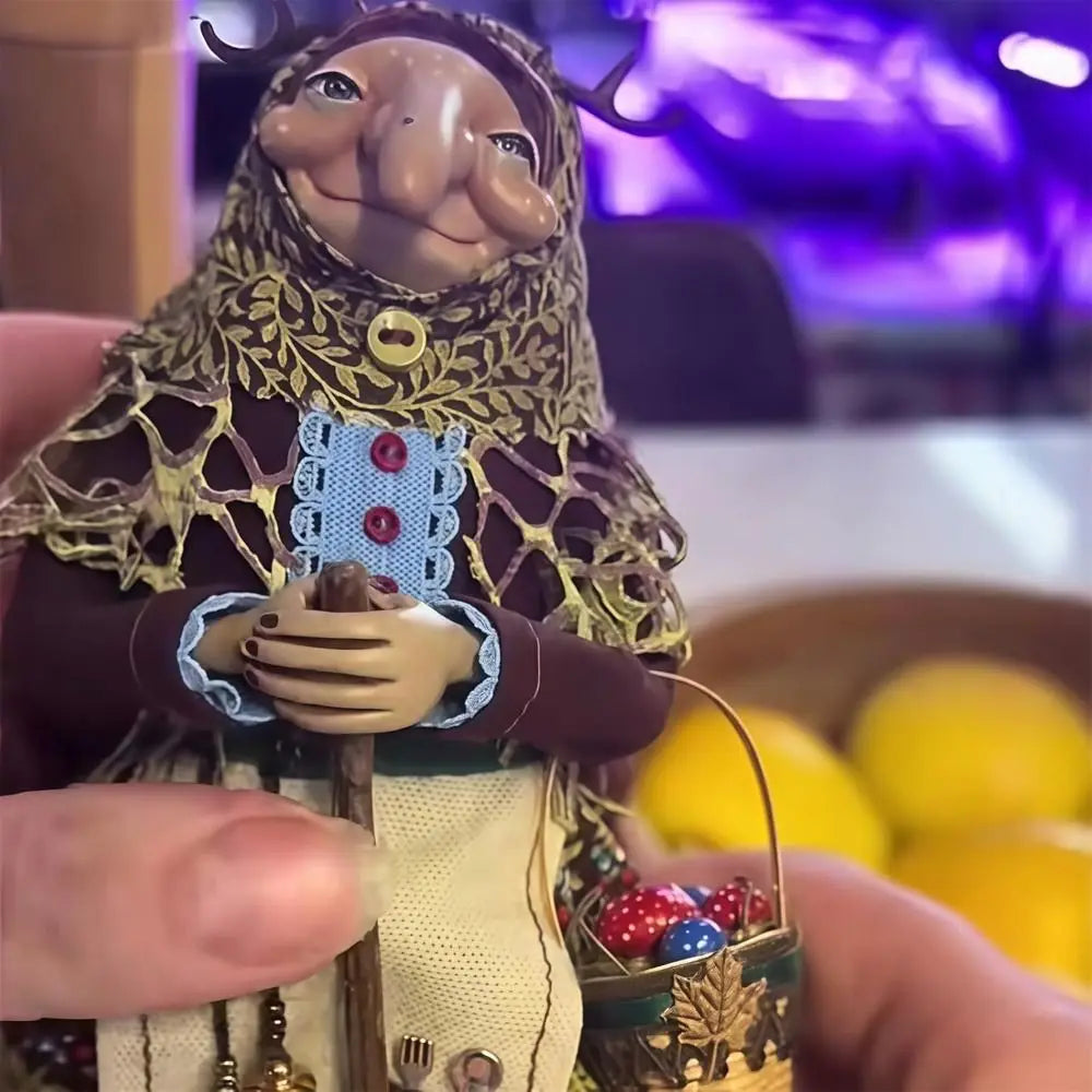 Handcrafted kitchen witch doll with antique charm featuring a brown outfit and gold detailing.