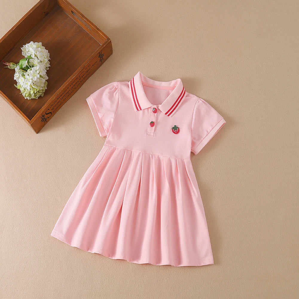 A pink kids summer cotton dress with a turn-down collar and a small fruit embroidery, displayed on a neutral background.