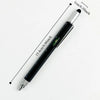 Stylo multi-outil noir de précision avec règle, présenté en diagonale sur fond blanc.