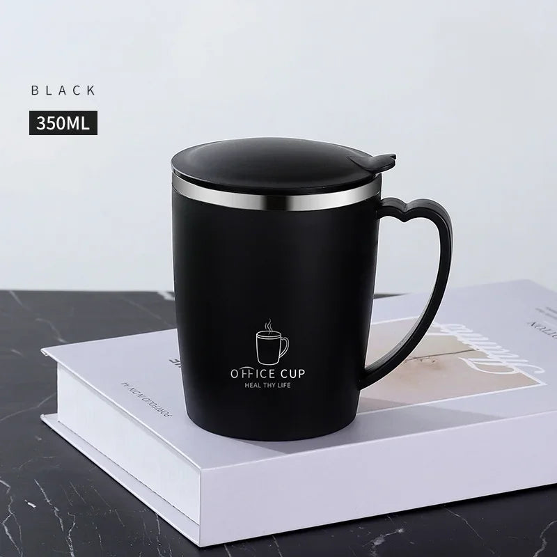 A black 350ml stainless steel insulated travel mug with a handle resting on a white box.