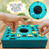 A hand is setting the timer on a teal shape matching puzzle game for kids, with a close-up view of the timer dial.