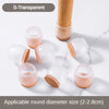 S-transparent silicone furniture leg pads with felt bottoms for scratch protection, shown next to a wooden dowel.