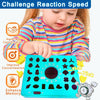 A toddler is playing a blue shape matching puzzle game with various cutouts and a timer.