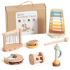 A set of seven wooden musical instruments, including a guitar, drums, and various other instruments, packaged in a cardboard 